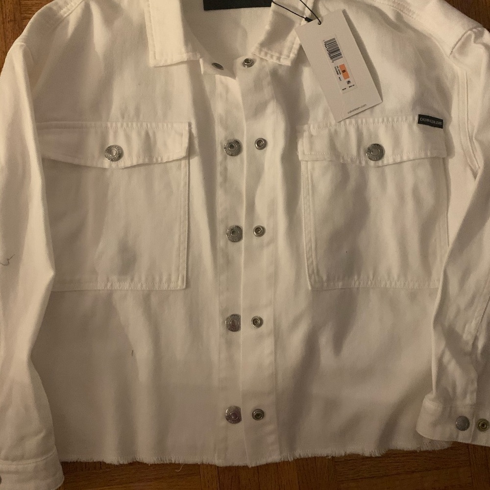 Woman white denim Calvin Klein jacket